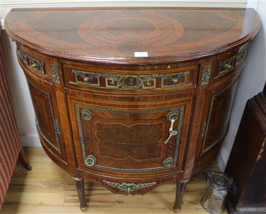 A Louis XVI ormolu mounted and banded kingwood and mahogany D shaped side cabinet W.113cm